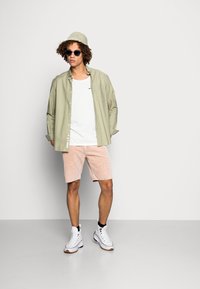 Nudie Jeans RELAXED TANK UNISEX - Top - chalk white