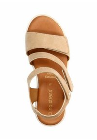 Beige sandal with three overlapping straps, adjustable buckle, and cushioned insole. Features a smooth texture and light-colored sole.
