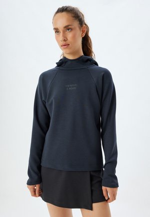Sweatshirt à capuche bleu marine avec manches longues ; arbore un graphique texte subtil "L'AVENIR EST À VOUS" dans une couleur contrastante au niveau de la poitrine.