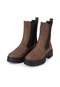 Brown suede ankle boots with elastic side panels and a chunky black rubber sole. Features heel tabs for easy wearing. Smooth texture.