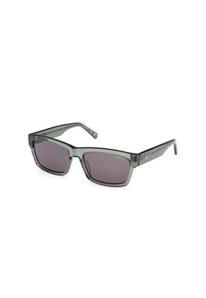 Occhiali da sole rettangolari con montatura trasparente grigio scuro e lenti viola sfumate. Accentuati da un branding discreto sulle astine.