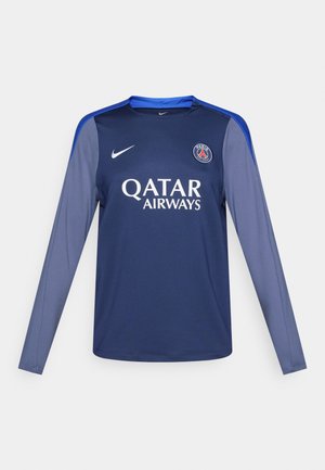 Laivastonsininen pitkähihainen paita sinisillä yksityiskohdilla, Nike-logo rinnassa ja "QATAR AIRWAYS" valkoisella tekstillä. Sileä kangas, urheilullinen istuvuus.