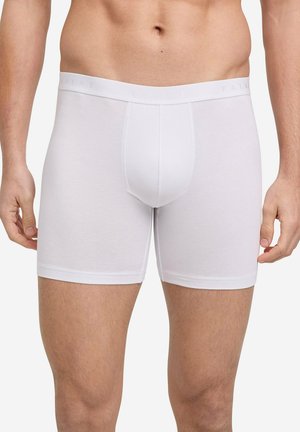 Witte katoenen boxershorts met een zachte tailleband waarop de merknaam "FALKE" staat, wat zorgt voor een comfortabele pasvorm en een minimalistisch ontwerp.