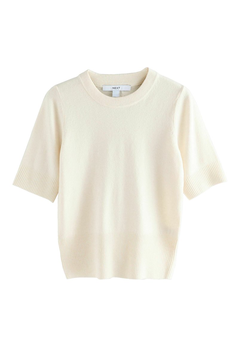 Pull en tricot à manches courtes de couleur crème avec un col rond côtelé, des manches côtelées et un ourlet, présenté sur un fond blanc.