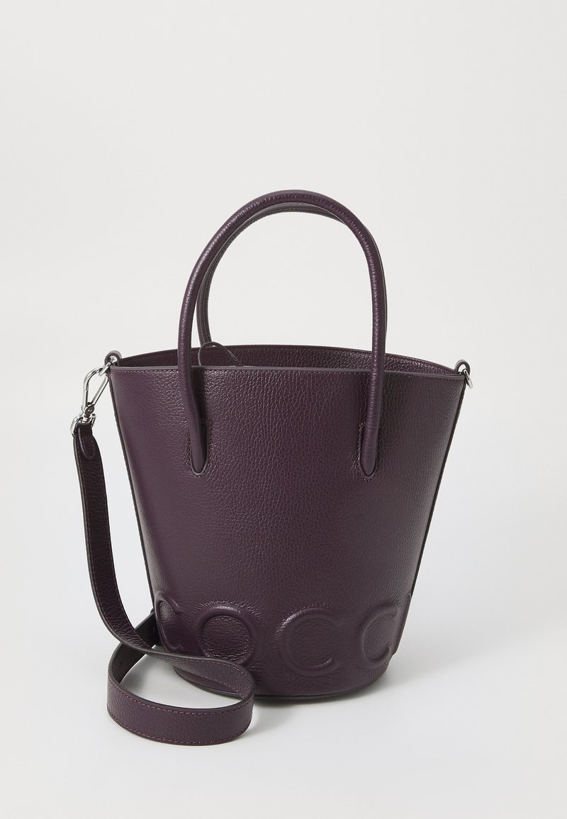 Purple leather bucket bag with a textured surface, two round handles, and a detachable shoulder strap. Features embossed lettering on the front.