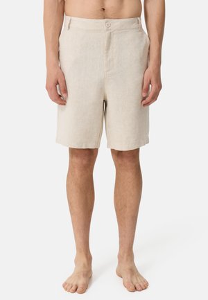 Beige linen shorts with a flat front, two side pockets, and a single button closure. Straight cut with a smooth texture. No patterns or accents.