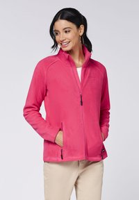Fleece jacket in bright pink, featuring a high collar, zippered front, and side pockets with zippers. Soft texture and snug fit.