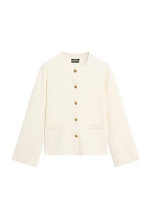 Kurze weiße Strickjacke aus weichem Material mit rundem Ausschnitt, langen Ärmeln und goldenen Knöpfen vorne. Zwei Fronttaschen.