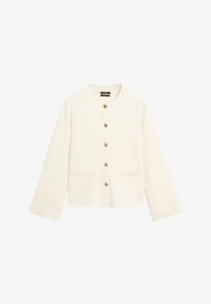 Kurze weiße Strickjacke aus weichem Material mit rundem Ausschnitt, langen Ärmeln und goldenen Knöpfen vorne. Zwei Fronttaschen.