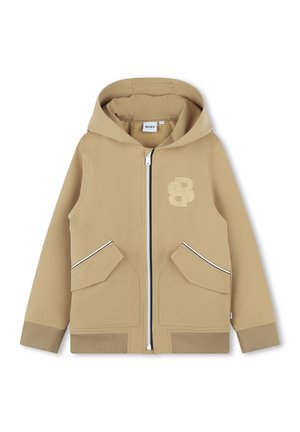 Sweat à capuche beige à fermeture éclair avec une grande capuche, deux poches avant, des poignets côtelés et un logo brodé sur le côté gauche. Tissu lisse et extensible.