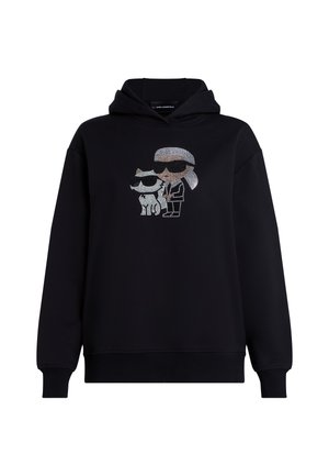 Un hoodie noir avec un graphisme en strass représentant un personnage portant des lunettes de soleil à côté d'un chien, tous deux avec des contours marqués. Tissu doux et texturé.