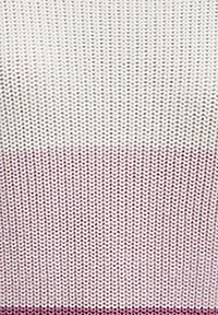 Knit fabric with a gradient design, transitioning from light cream at the top to soft mauve at the bottom. Textured, loose weave pattern.