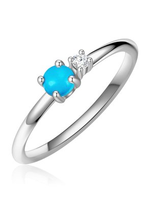 Ezüst gyűrű, kerek türkiz drágakővel és egy kis gyémánt díszítéssel, sima szalaggal, fényes felülettel, minimalista kialakítással.