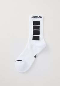 Valge crew sokk mustade ristkülikukujuliste triipudega säärtel, peal "JORDAN" tekst ja must detail valges sokis varbapiirkonnas.