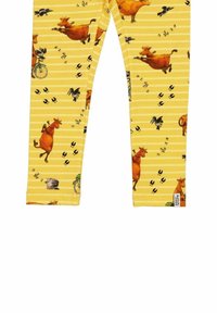 Keltaiset legginsit, joissa on leikkisiä lehmä- ja lintukuva-aiheita, raidoituskuvio ja pieniä eläinten jalanjälkiä. Pehmeää ja joustavaa kangasta.