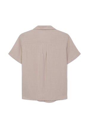 Camicia a maniche corte in tessuto beige chiaro con colletto classico, dettaglio con piega sul retro e orlo curvo per facilitare i movimenti.