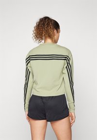 adidas Sportswear FUTURE ICONS THREE STRIPES LONG SLEEVE - Hosszú ujjú felső - tent green