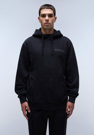 Black cotton hoodie with a textured finish, front kangaroo pocket, drawstring hood, and logo detail on the chest. Relaxed fit.