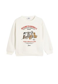 Sudadera de color crema con un gráfico de varios perros y un texto que promueve la adopción de animales. Puños y dobladillo acanalados. Material de algodón suave.