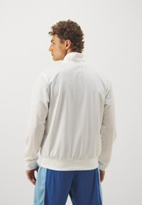 Lotto JACKET - Treningsjakke - bright white
