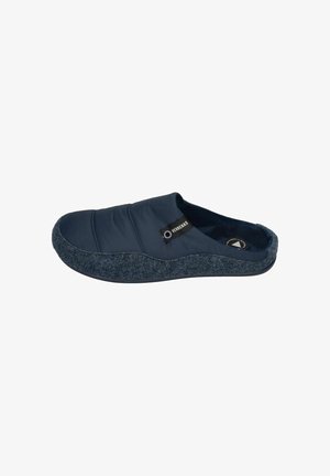 Navy slipper with a quilted upper, soft fabric texture, and a grey felt sole. Features a black logo tag on the side. Slip-on design.