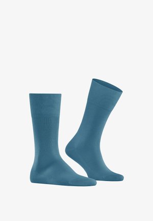 Helle blaue Socken aus glattem, elastischem Stoff, mit einem gerippten Bündchen und nahtloser Zehenpartie für zusätzlichen Komfort. Zwei Socken abgebildet.