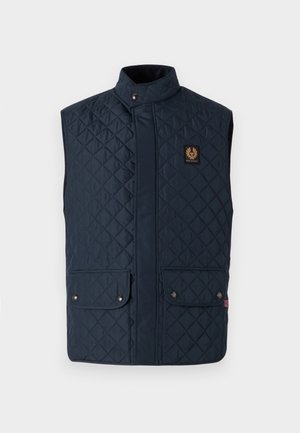 Navy quilted vest with a stand collar, two front snap pockets, and a logo patch. Smooth texture with diamond pattern detailing.