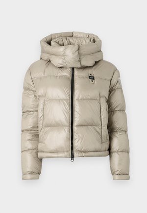 Giacca imbottita di colore beige chiaro con colletto alto, zip frontale e motivo a quadri orizzontali; presenta un piccolo logo sul petto.