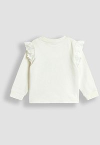 Langsleeve shirt van zacht wit stof, met ruches op de schouders, een ronde hals en geribde manchetten voor extra textuur en detail.