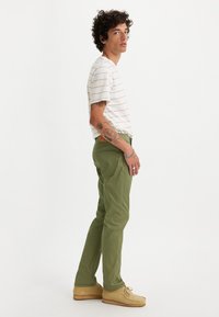 Levi's® 502™ TAPER JEANS - Straight leg jeans - bluish olive
