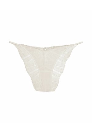 Lace thong in off-white, featuring a textured design with ruffled edges, thin straps, and a small metal detail at the back.