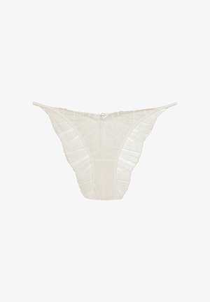 Lace thong in off-white, featuring a textured design with ruffled edges, thin straps, and a small metal detail at the back.