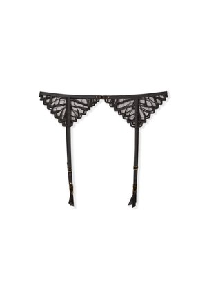 Giarrettiera in pizzo nero con bordi scallop, cinturini regolabili e hardware in tonalità oro. La trama trasparente esalta il suo design intricato.