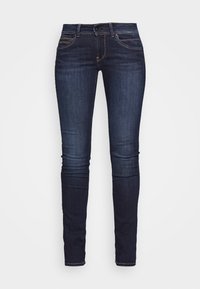 Tmavě modré úzké džíny vyrobené z denimu. Disponují klasickým pětipocket designem se švy a hladkou texturou.