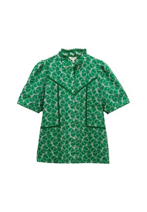 Green short-sleeve shirt with floral pattern and lace-like detailing. Features ruffled collar and two front pockets with trim accents.