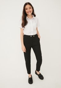 Next Nohavice - black