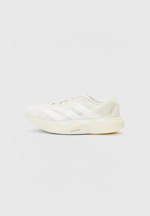 White athletic shoe with mesh upper, featuring three white stripes, a rounded toe, and a light-colored sole labeled "LIGHTSTRIKE PRO."