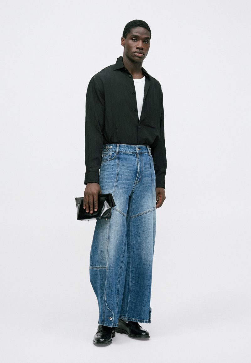 Feng Chen Wang PATCHED TROUSERS - Relaxed fit jeans - blue 