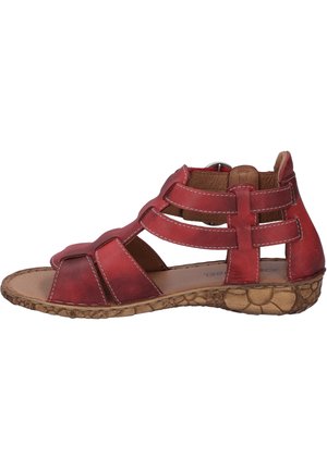 Red leather women's sandal with open toe, multiple straps, ankle support, and textured brown sole.