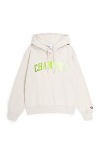 Felpa beige in misto cotone, con un grande logo riflettente verde "CHAMPION" sul petto e un'etichetta con il logo sul polsino.