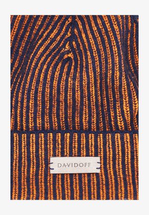 Knitted beanie hat in orange and navy with vertical stripes. Features a textured surface and a tag labeled "DAVIDOFF."
