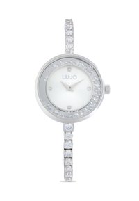 Silberne Uhr mit rundem Ziffernblatt, weißem Ziffernblatt, Kristallakzenten und einem funkelnden Armband, das mit abwechselnd quadratischen und runden Steinen verziert ist.