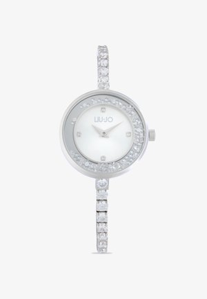 Orologio argento con cassa rotonda, quadrante bianco, dettagli in cristallo e bracciale scintillante decorato con pietre quadrate e rotonde alternate.