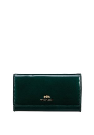 Green patent leather wallet with a fold-over design, gold logo accent, and smooth texture. Features stitching along the edges.