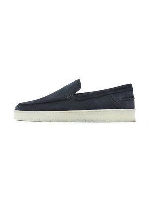 Navy blue suede slip-on loafer with white crepe sole and low heel, side logo detail, and rounded toe.