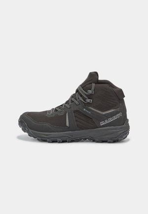 Black hiking boots with a high-top design, synthetic upper, textured accents, and rubber outsole with traction grooves. Features reflective elements.