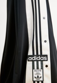 adidas Originals MEGA - Παντελόνι φόρμας - black