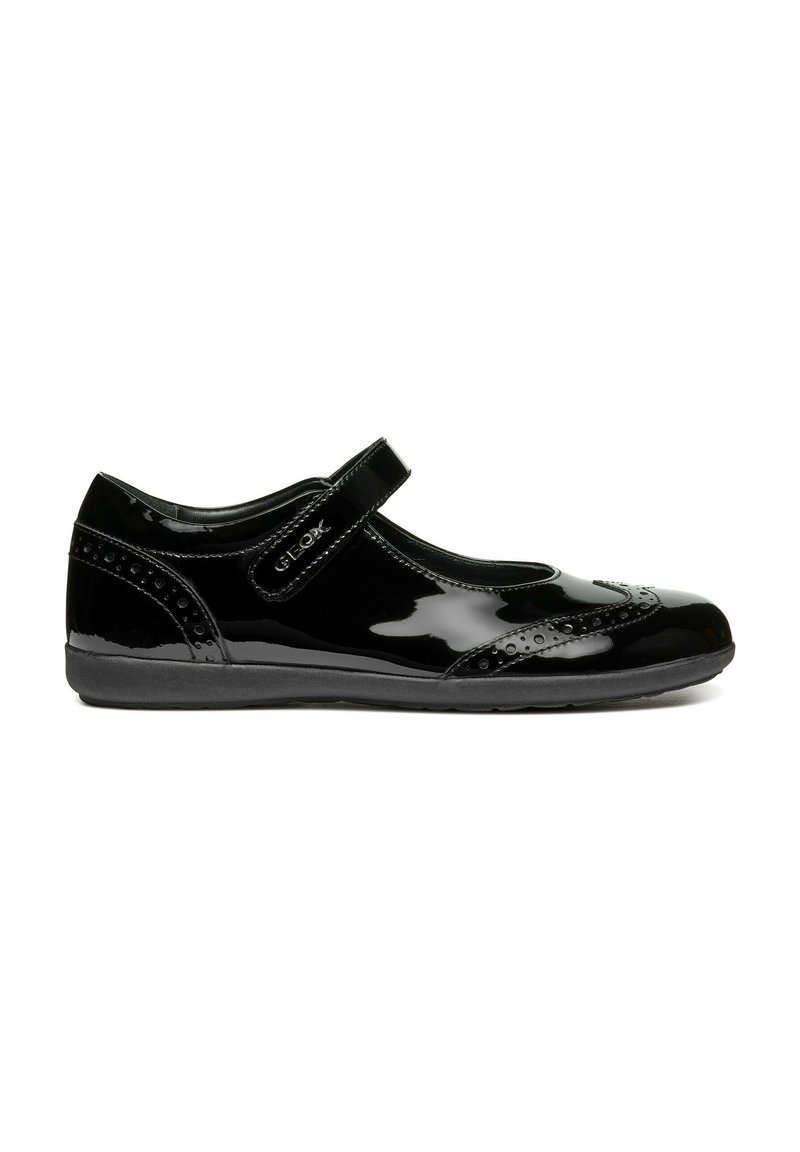 Black patent leather Mary Jane shoe with a round toe, perforated design, adjustable strap, and a soft rubber sole for comfort.