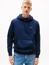 Navy hoodie made of cotton blend fabric, featuring a front kangaroo pocket and drawstring hood. Small logo on the chest, ribbed cuffs.