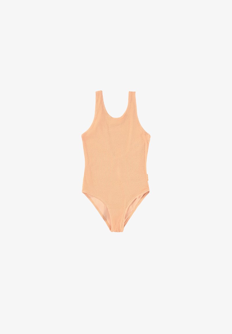 Μαγιό ολόσωμο χρώματος ροδακινί με υφή πλεκτού σχεδίου, φαρδιές σχοινί μπράτσες και στυλ υψηλής κοπής ποδιού. Χωρίς ορατά εξαρτήματα ή αξεσουάρ.